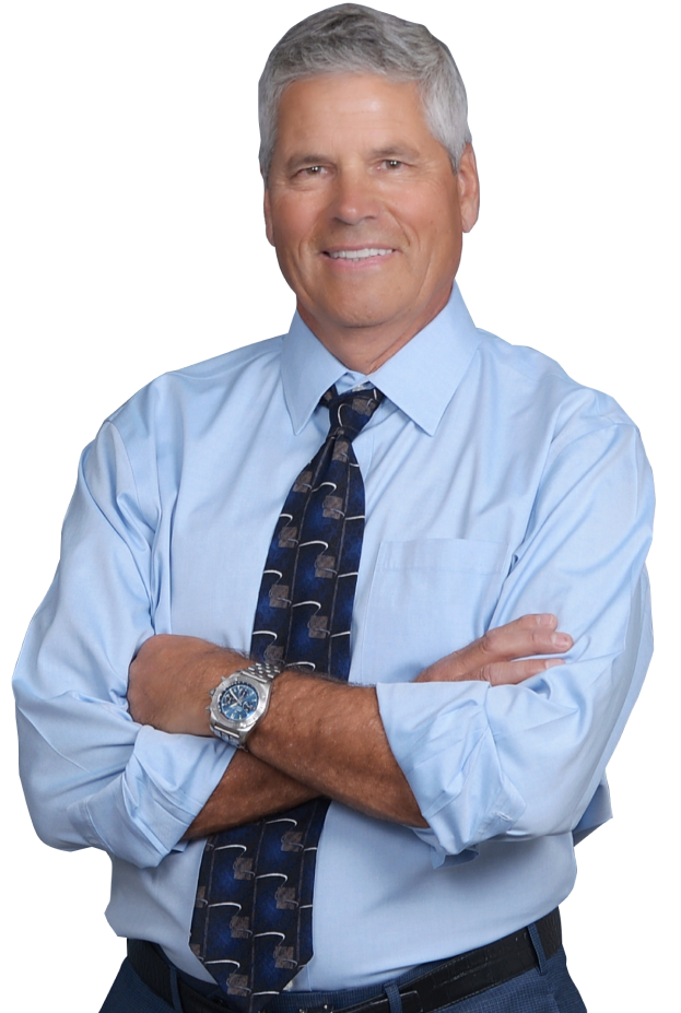 A man in a blue shirt and tie posing for a photo.